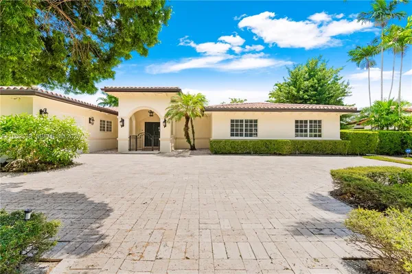 an aerial view of a houses with a lake view