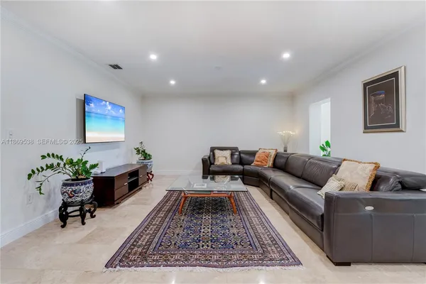 a living room with furniture and a rug