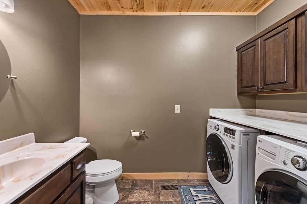 479 Big Timber Road Mineral Bluff, GA 30559 - Photo 18 of 60 a bathroom with a sink a toilet and vanity