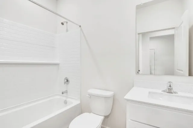 a bathroom with a sink a toilet and a bathtub