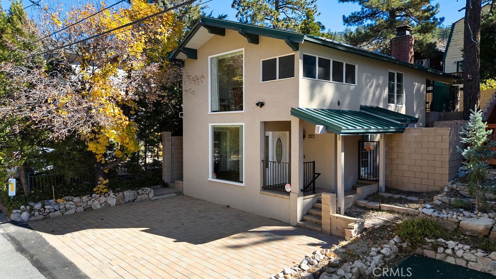 33353 Music Camp Road Running Springs, CA 92382 - Photo 1 of 30 a front view of a house with yard and trees