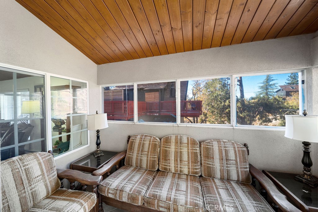 33353 Music Camp Road Running Springs, CA 92382 - Photo 16 of 30 a living room with furniture stove and large window