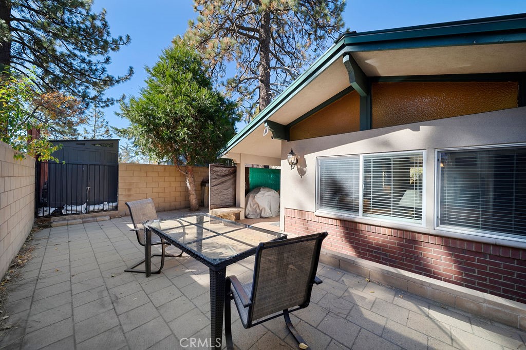 33353 Music Camp Road Running Springs, CA 92382 - Photo 17 of 30 a view of a dinning table and chairs in patio of the house