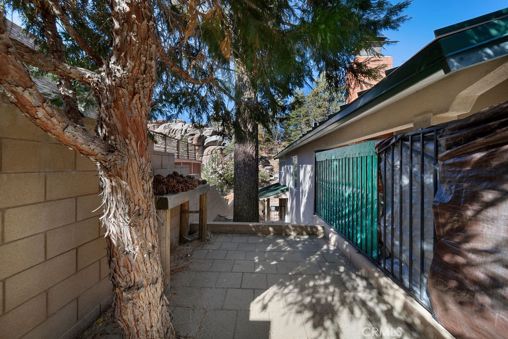33353 Music Camp Road Running Springs, CA 92382 - Photo 21 of 30 a view of a pathway of a house with a tree