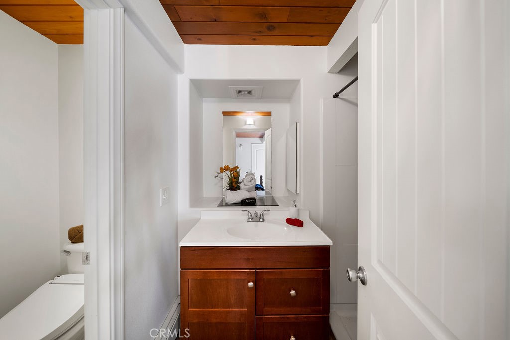 33353 Music Camp Road Running Springs, CA 92382 - Photo 23 of 30 a bathroom with a sink and a mirror