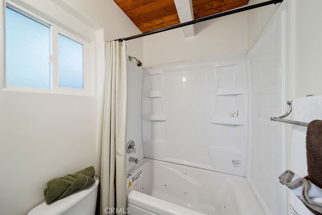 33353 Music Camp Road Running Springs, CA 92382 - Photo 24 of 30 a bathroom with a bathtub and a shower