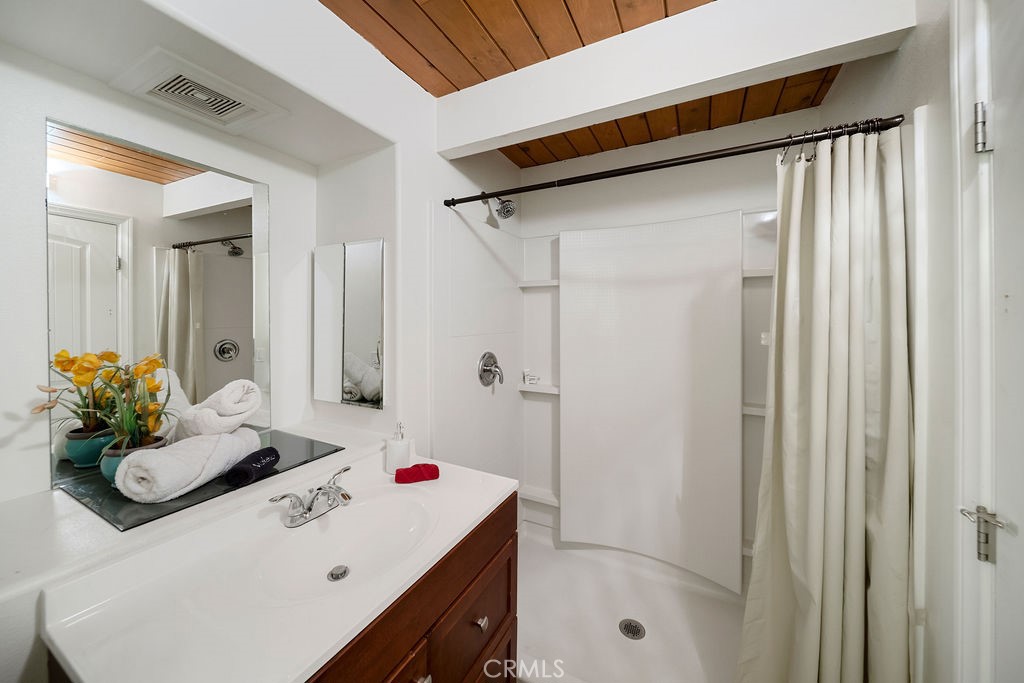 33353 Music Camp Road Running Springs, CA 92382 - Photo 25 of 30 a bathroom with a sink vanity and shower