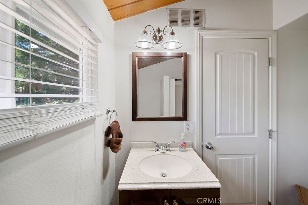 33353 Music Camp Road Running Springs, CA 92382 - Photo 26 of 30 a bathroom with a sink and a mirror