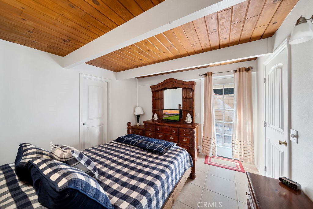 33353 Music Camp Road Running Springs, CA 92382 - Photo 28 of 30 a bedroom with a bed and wooden floor
