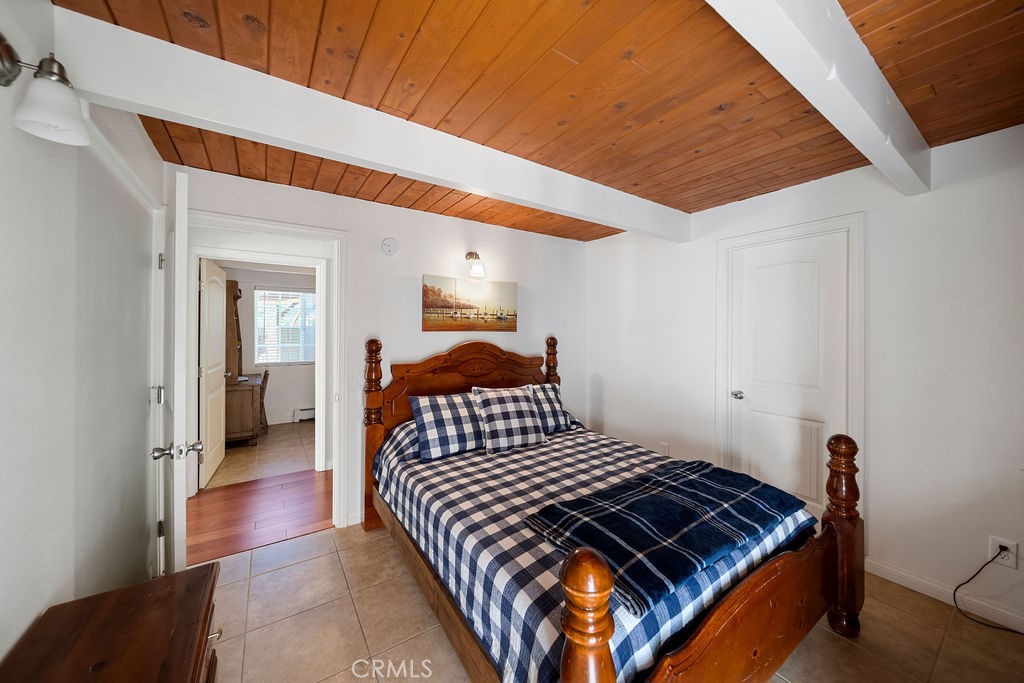 33353 Music Camp Road Running Springs, CA 92382 - Photo 3 of 30 a bedroom with a bed and a walk in closet