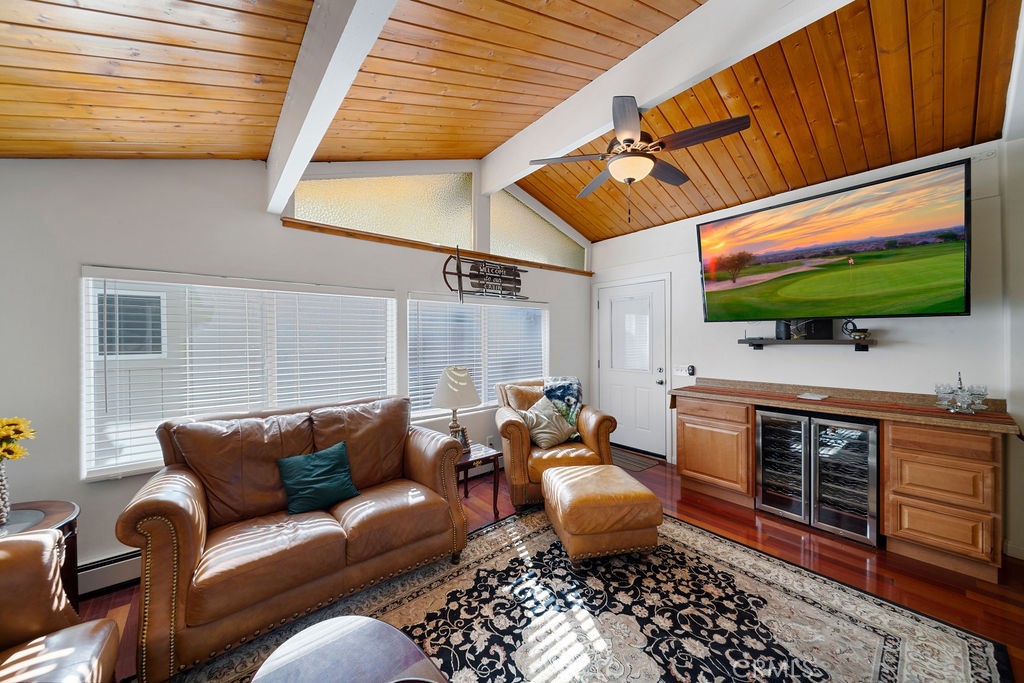 33353 Music Camp Road Running Springs, CA 92382 - Photo 9 of 30 a living room with furniture a flat screen tv and kitchen view