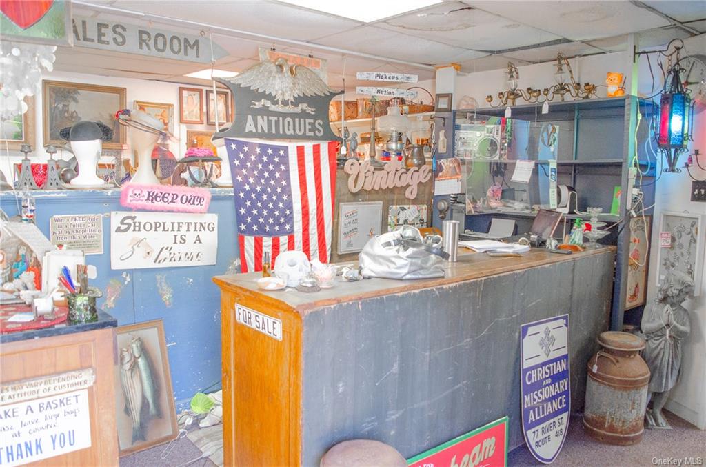 2530-2534 Rte 9W Ravena, NY 12143 - Photo 11 of 19 a bathroom with a sink a toilet and shower curtain