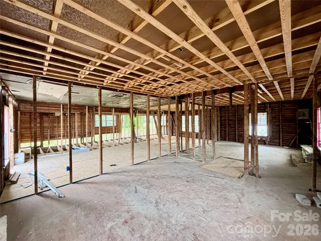 a view of a hall with wooden roof