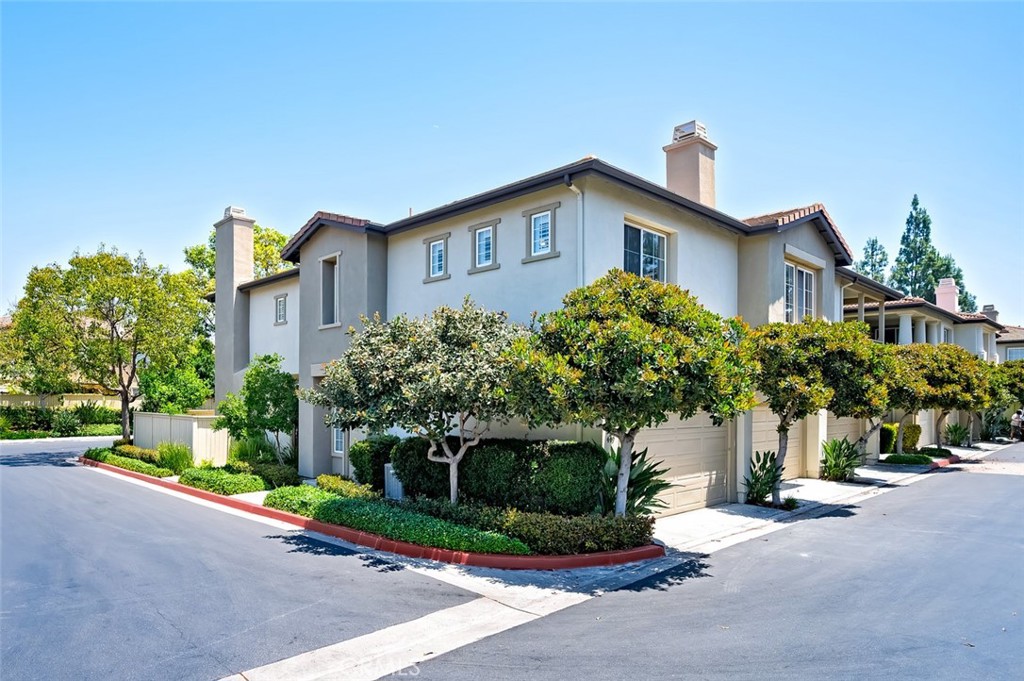 447 Ridgeway Irvine, CA 92620 - Photo 43 of 88 a front view of a house with a yard and garage