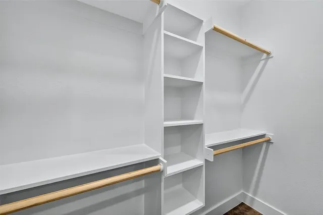 a view of an empty walk in closet