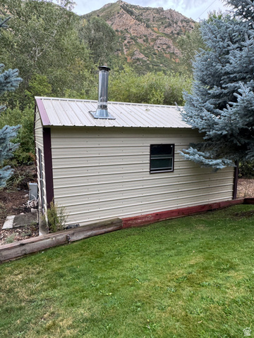 6633 Holiday Hills Road Springville, UT 84663 - Photo 11 of 30 Metal siding structure with a metal roof and a chimney