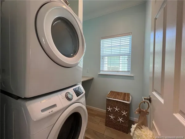 a view of a storage and utility room with washer and dryer