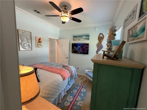 a bed room with a bed and a television