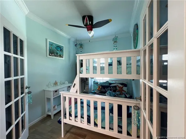 a bedroom with furniture and a window