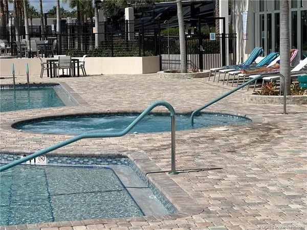a view of a swimming pool and a fountain