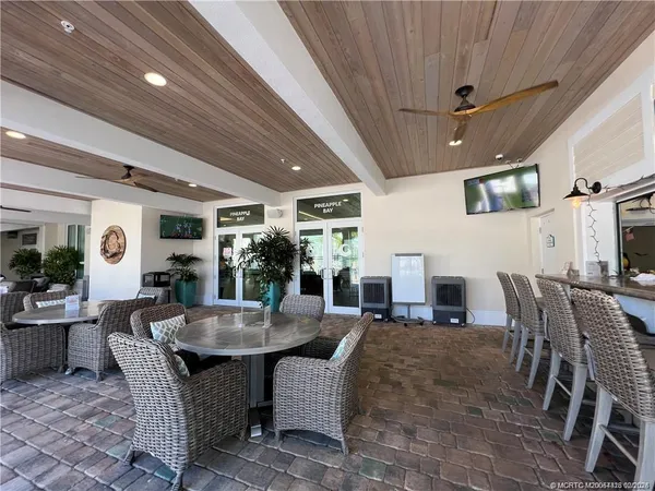 a view of a dining area with furniture and chandelier