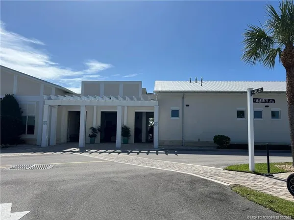 a view of a livingroom with furniture window and wooden floor