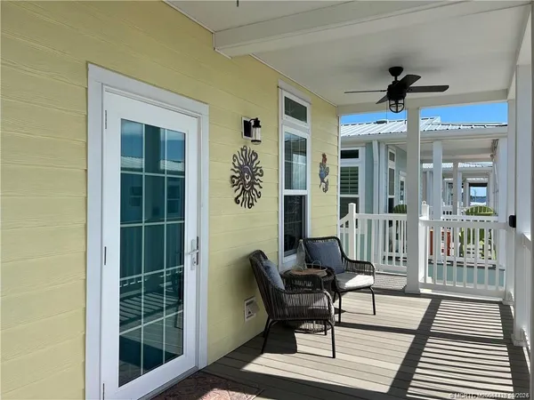 a view of a balcony with furniture