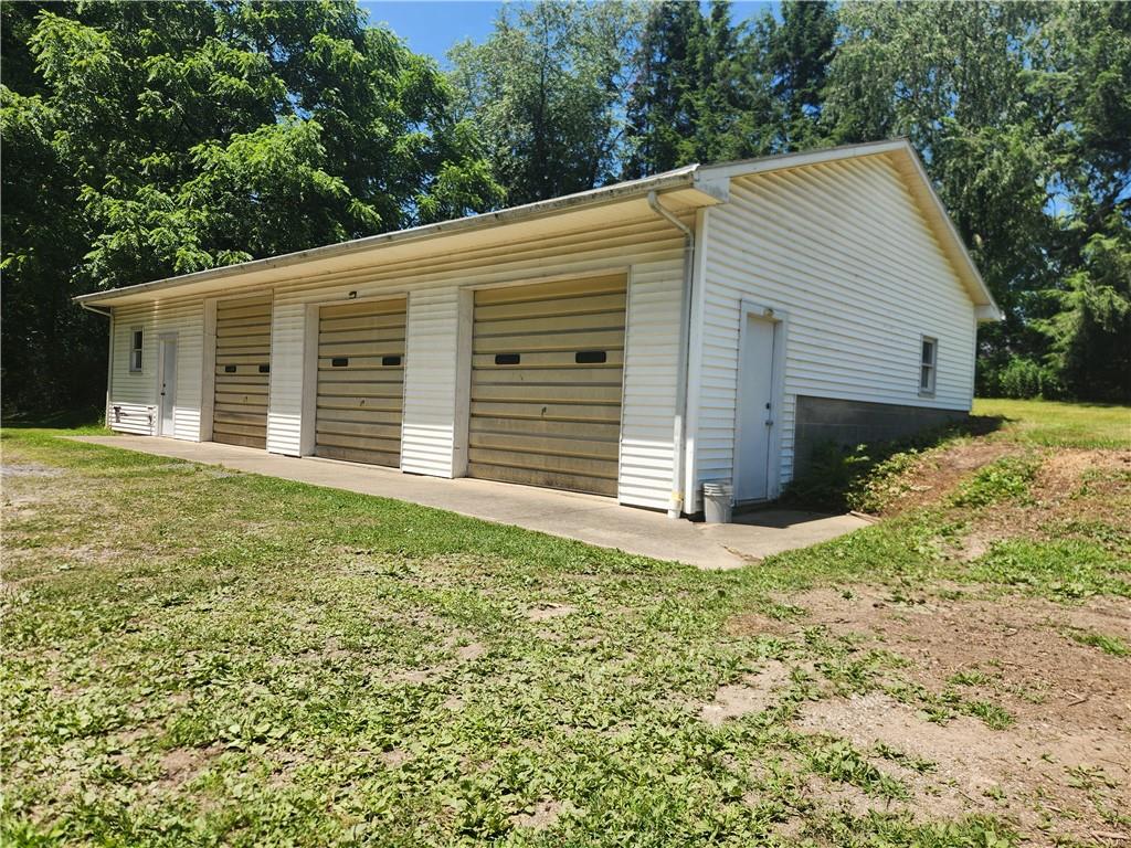 223 South Benbrook Road Butler, PA 16001 - Photo 5 of 31 This huge 3 stall garage with attach and attached work room with 2 sources of heat and 2 man doors.