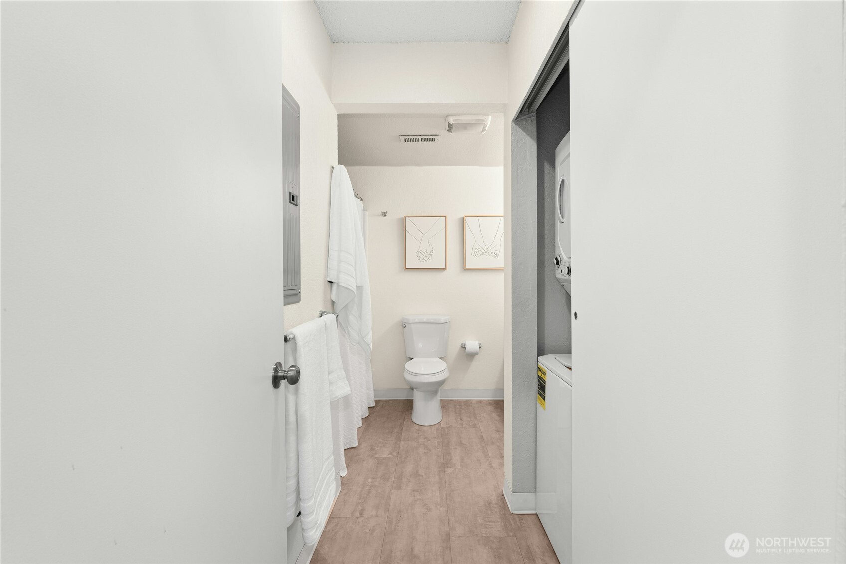 9523 Northeast 180th Street, Unit A102 Bothell, WA 98011 - Photo 19 of 29 a view of a bathroom with a toilet