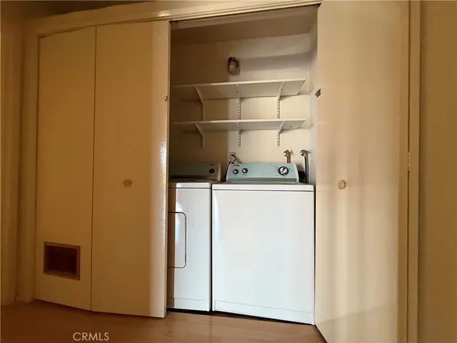 a kitchen with granite countertop a sink stove and cabinets