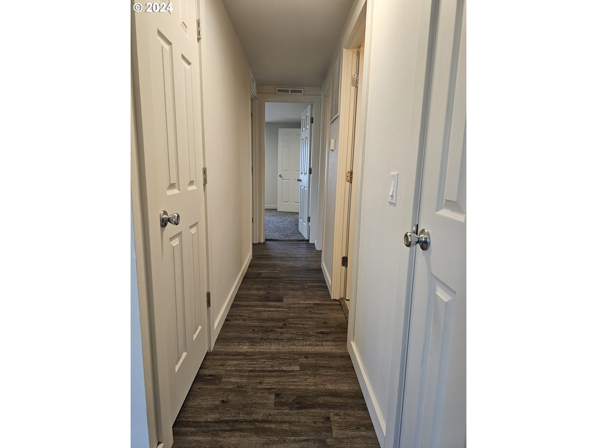 806 Southwest 10th Street Pendleton, OR 97801 - Photo 23 of 36 a view of a hallway with the wooden floor