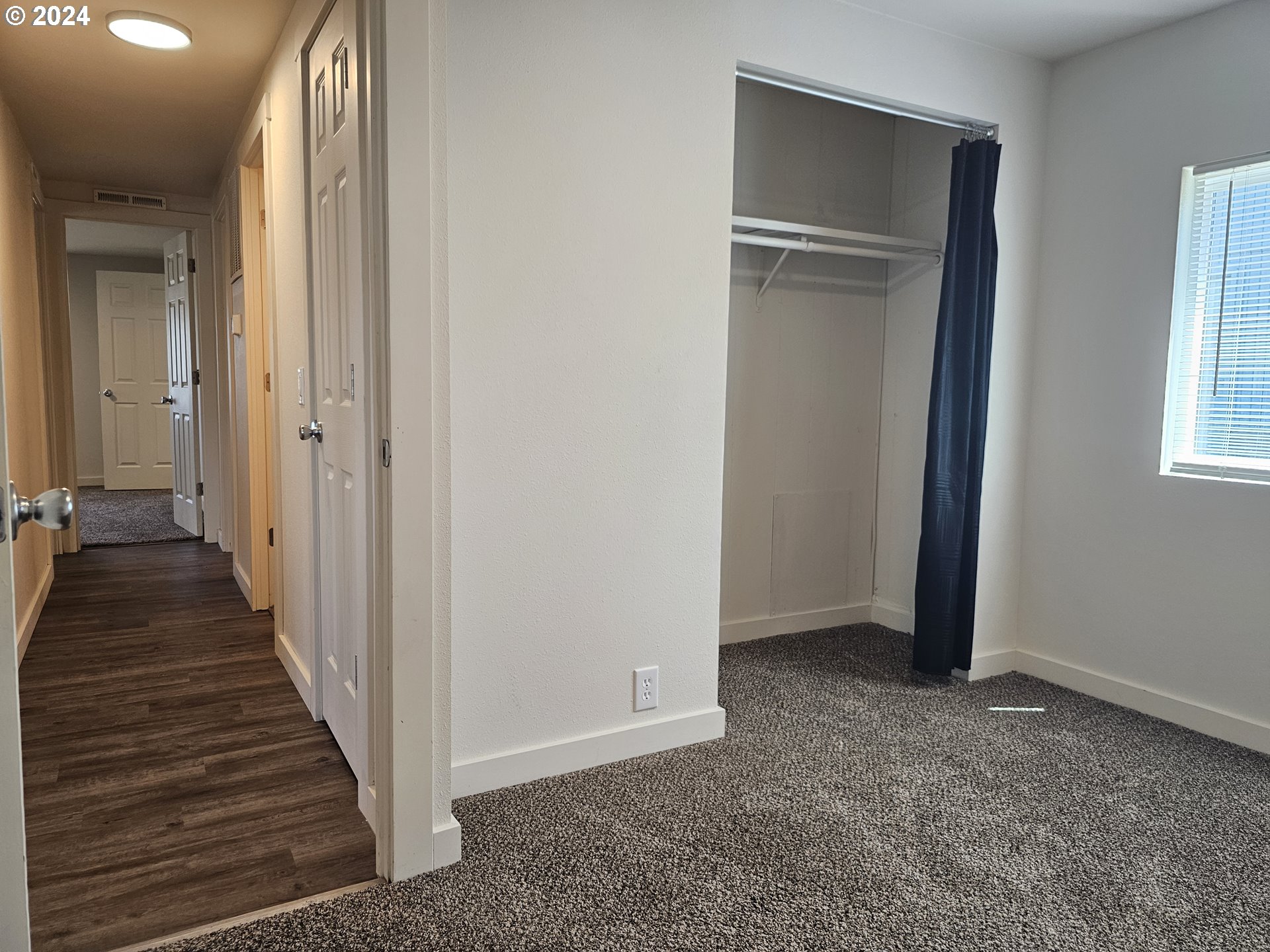 806 Southwest 10th Street Pendleton, OR 97801 - Photo 24 of 36 a view of a hallway with wooden floor and closet