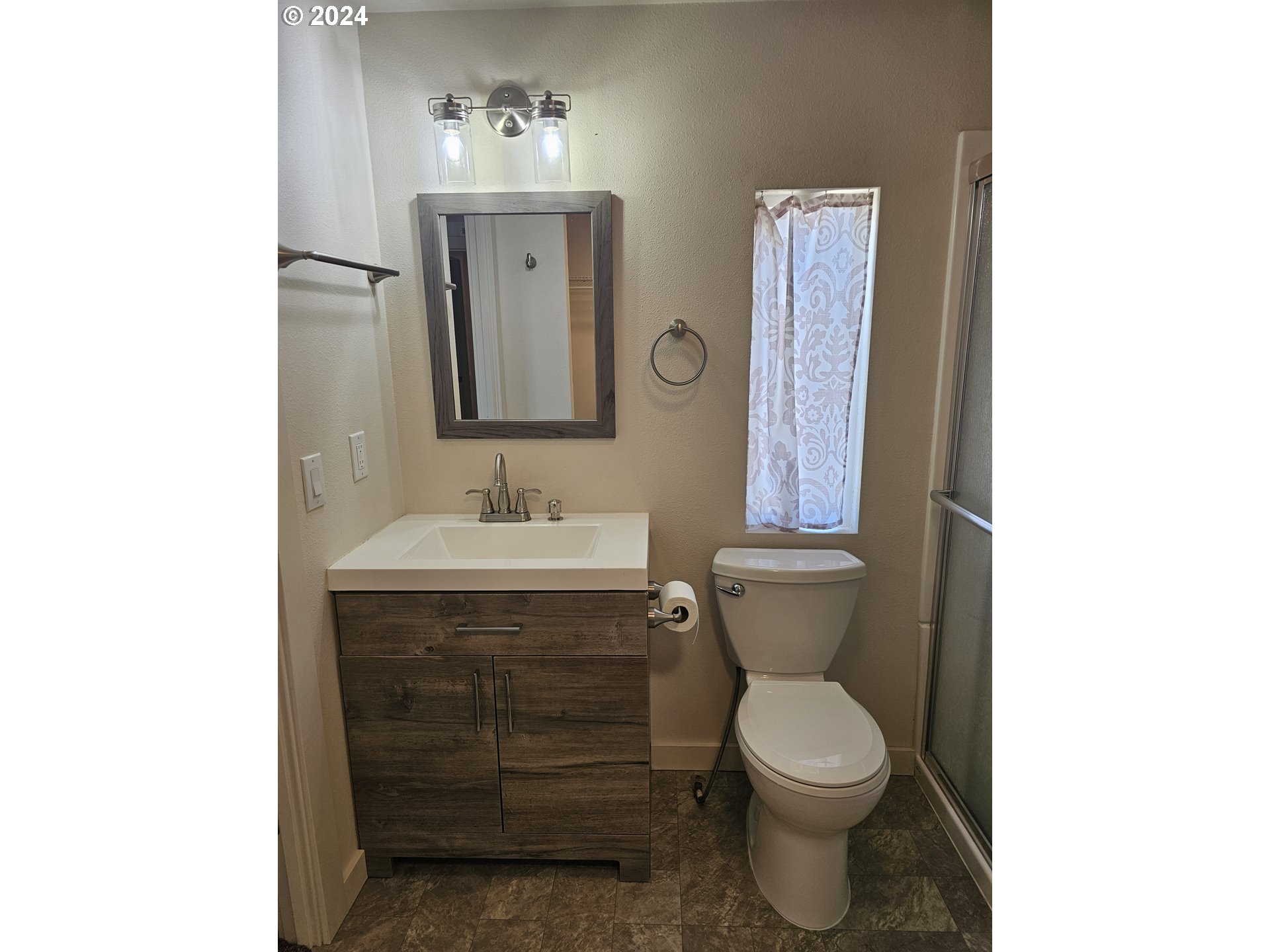 806 Southwest 10th Street Pendleton, OR 97801 - Photo 35 of 36 a bathroom with a toilet sink and mirror