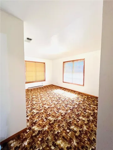 a bathroom with a sink mirror and a bathtub