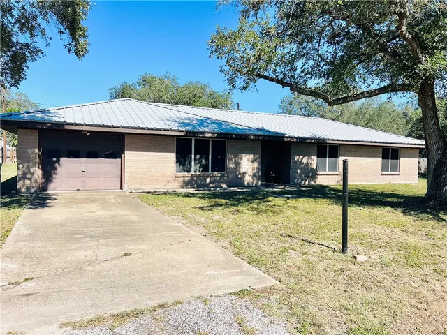 a front view of a house with swimming pool