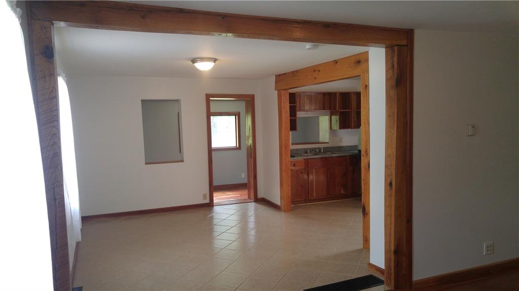 754 Purchase Line Road Clymer, PA 15728 - Photo 2 of 13 Dining room with ceramic tile, gorgeous oak beam archways to family room and kitchen