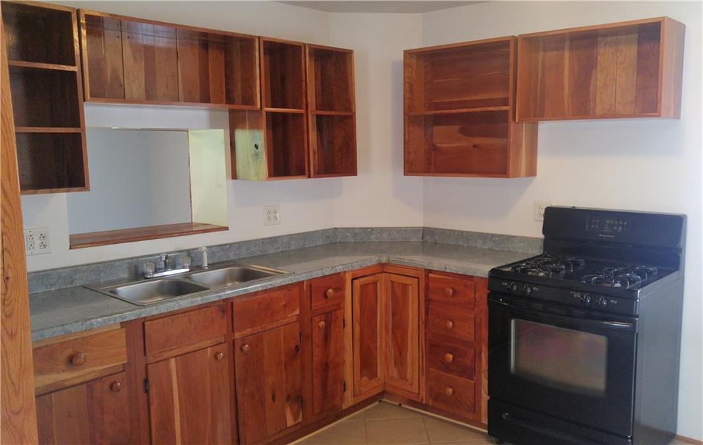754 Purchase Line Road Clymer, PA 15728 - Photo 4 of 13 These open-faced custom cherry cabinets showcase the beautiful woodwork in the kitchen