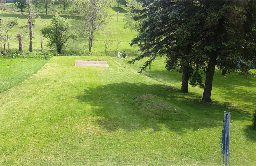 754 Purchase Line Road Clymer, PA 15728 - Photo 6 of 13 Spacious back yard leads to trout stream with a concrete pad ready for your outdoor furniture and firepit!