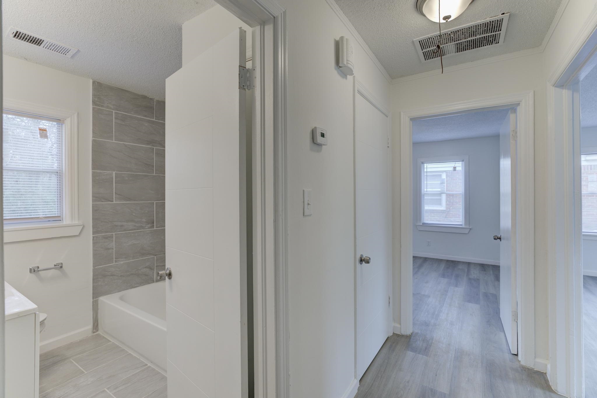 4422 Boyce Road Memphis, TN 38117 - Photo 13 of 21 a bathroom with a tub shower and a sink