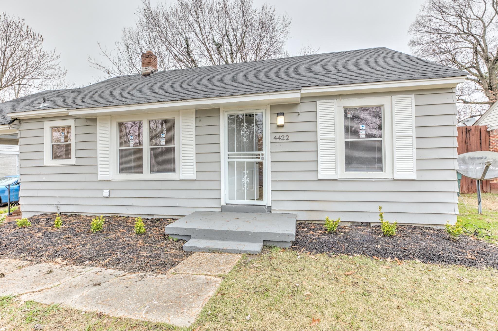 4422 Boyce Road Memphis, TN 38117 - Photo 4 of 21 a front view of a house with a yard and garage
