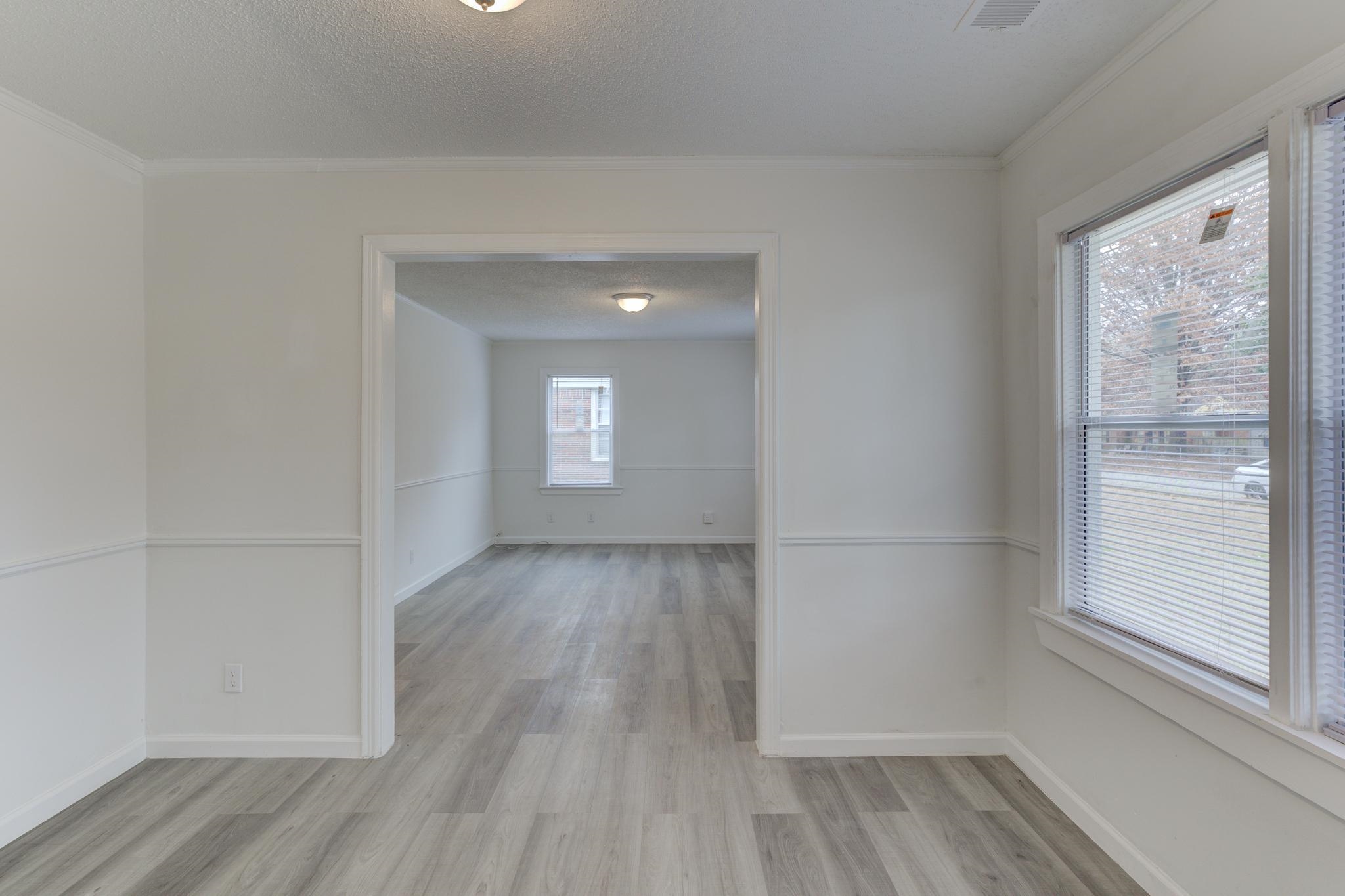 4422 Boyce Road Memphis, TN 38117 - Photo 8 of 21 a view of a livingroom with wooden floor and window