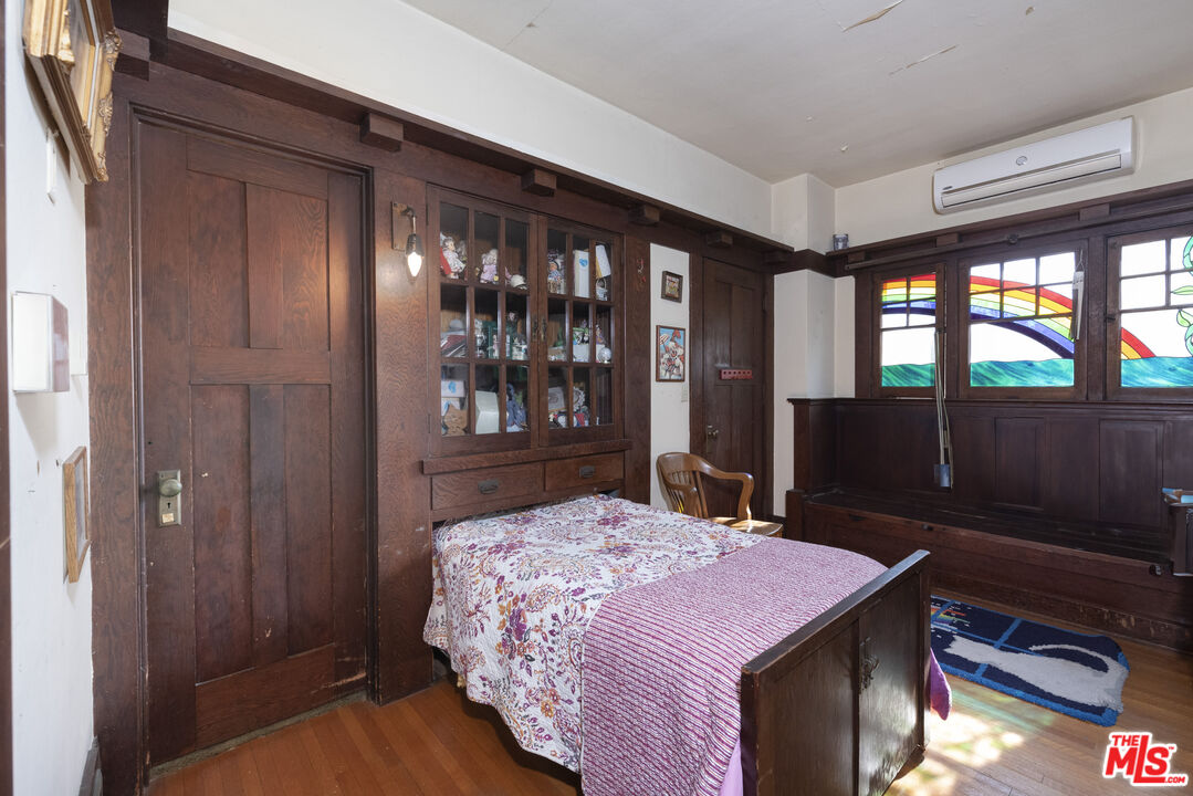 1432 Valley View Road Glendale, CA 91202 - Photo 8 of 17 a bedroom with a bed and a dresser next to a window