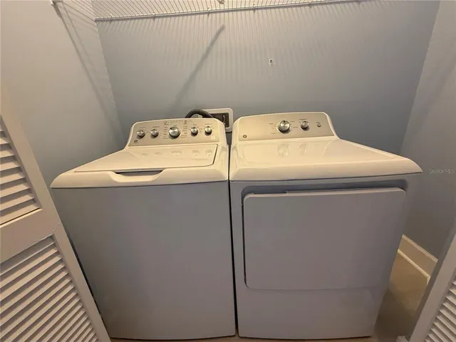 a utility room with dryer and washer