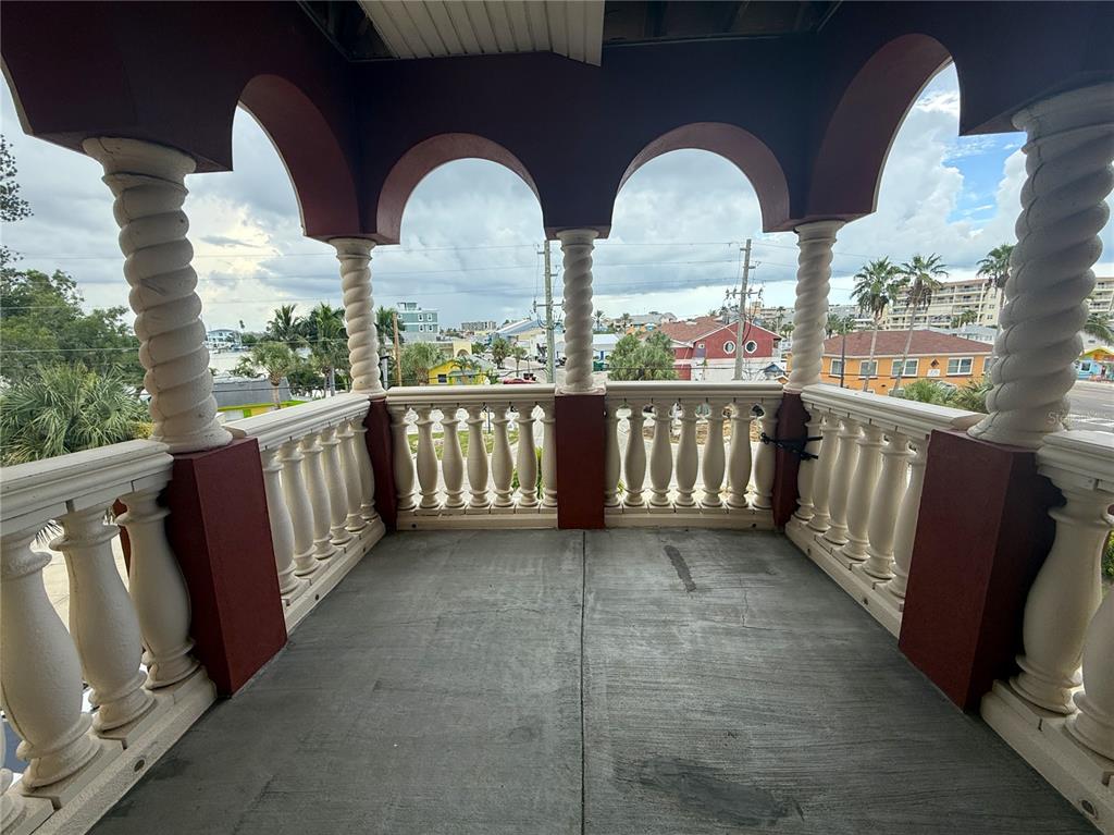 116 131st Avenue East, Unit C Madeira Beach, FL 33708 - Photo 27 of 41 a view of two chairs in balcony