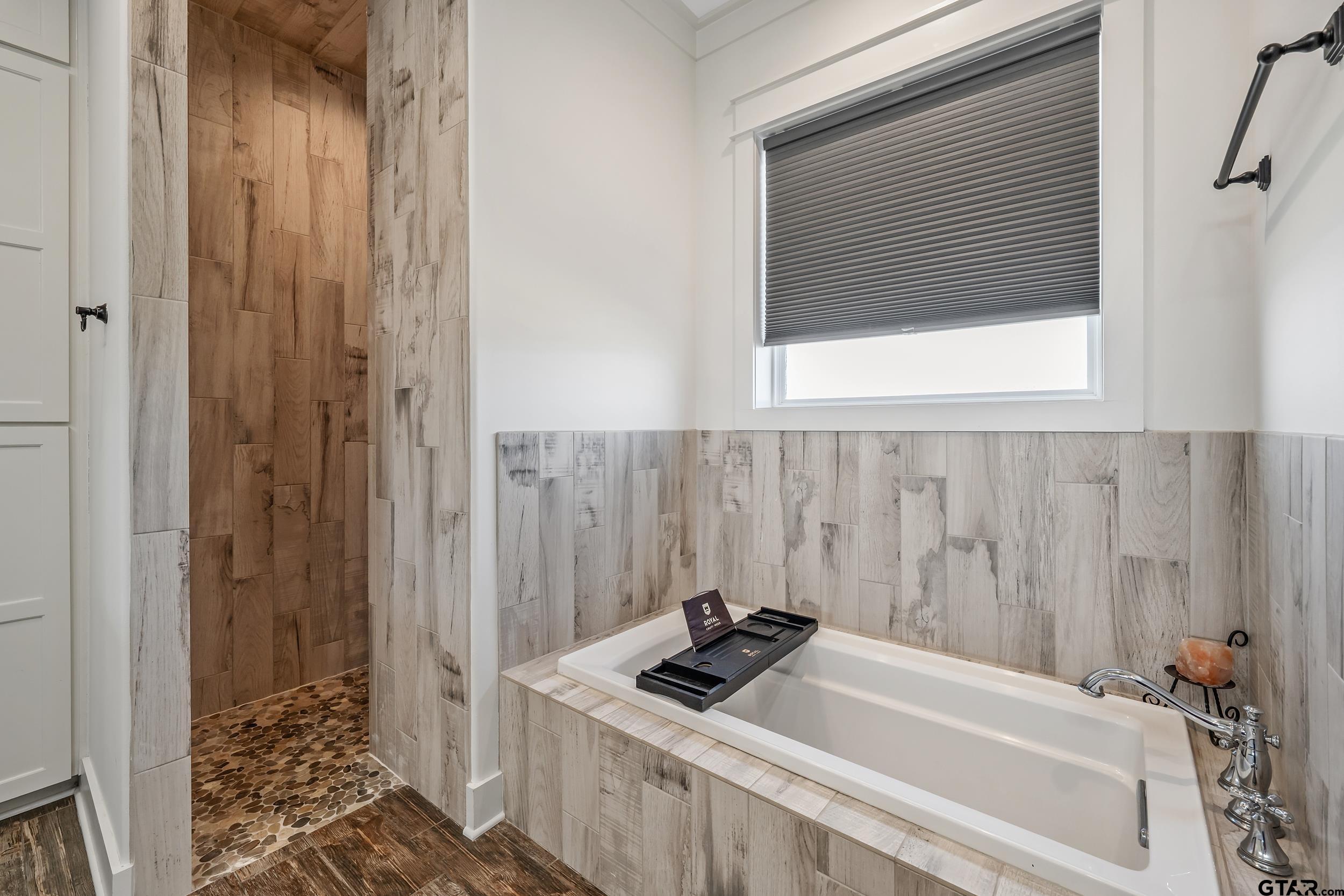 223 Riata Road Bullard, TX 75757 - Photo 17 of 45 a bathroom with a tub and shower