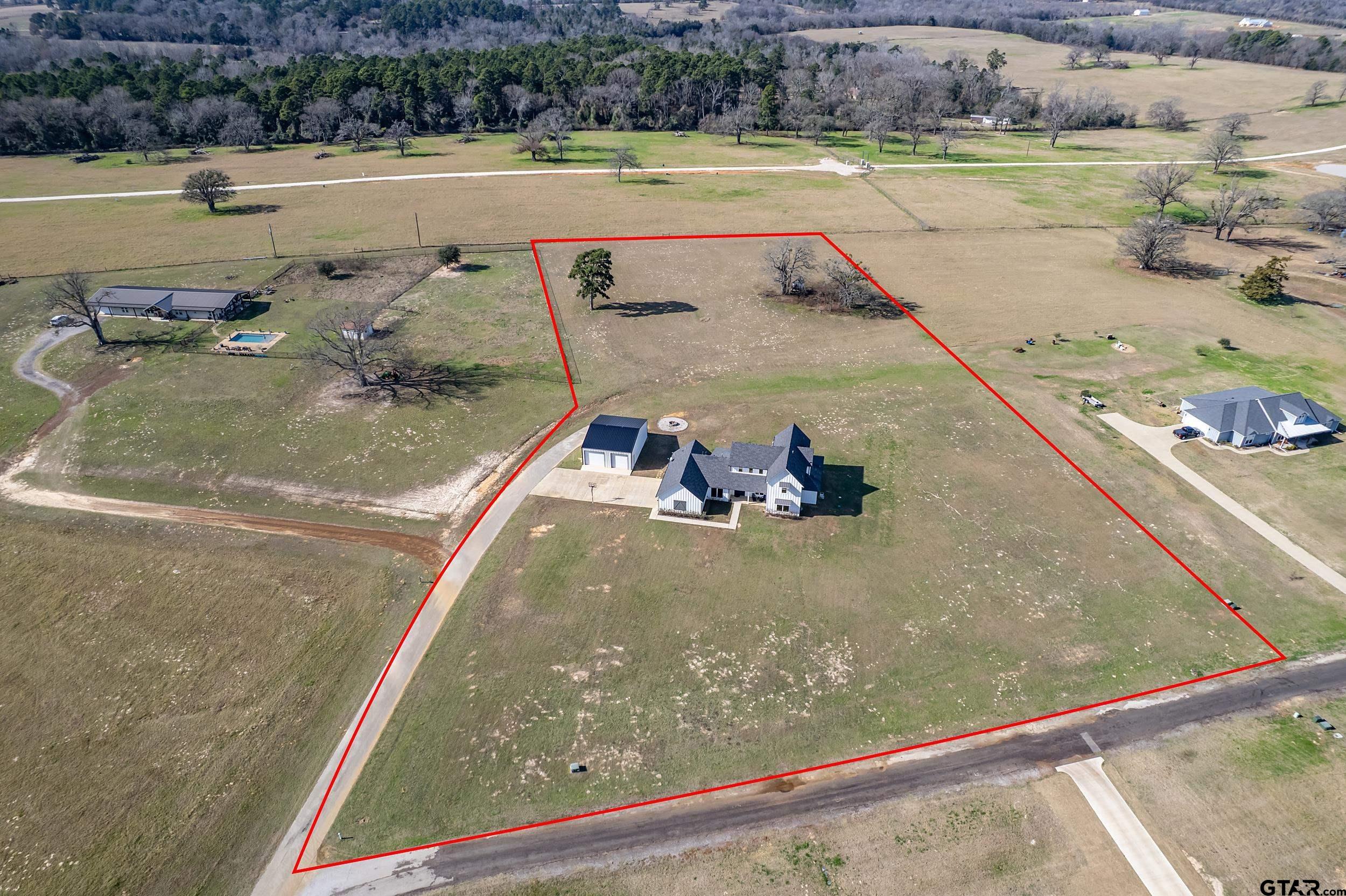 223 Riata Road Bullard, TX 75757 - Photo 2 of 45 a view of swimming pool with a yard