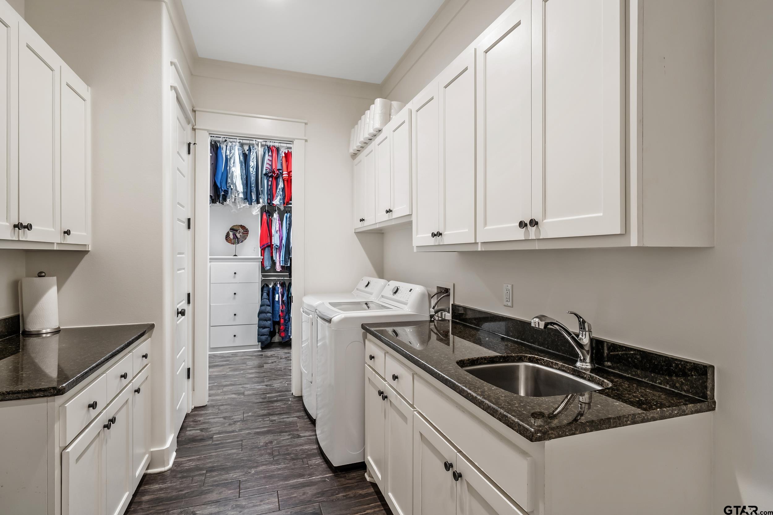 223 Riata Road Bullard, TX 75757 - Photo 26 of 45 a kitchen that has a sink and a stove top oven