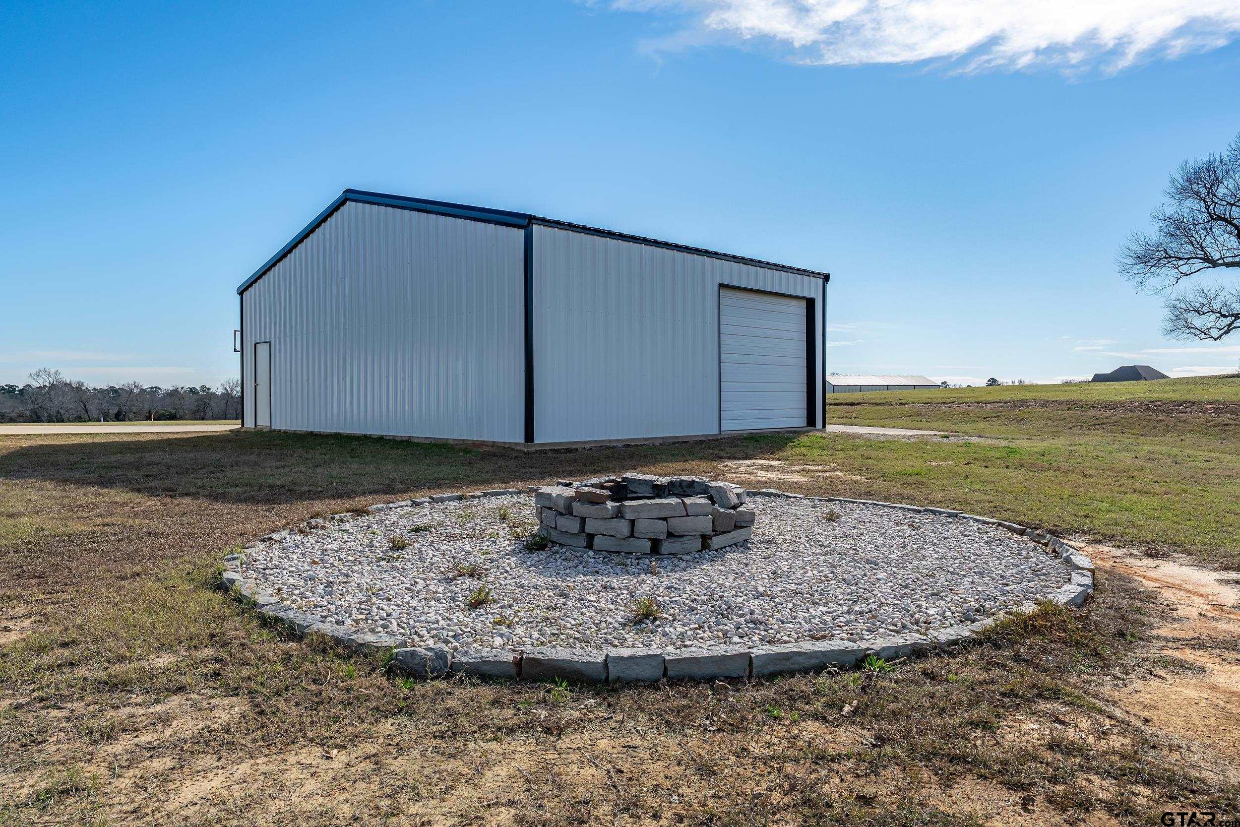 223 Riata Road Bullard, TX 75757 - Photo 31 of 45 a view of a backyard with lake view and mountain view