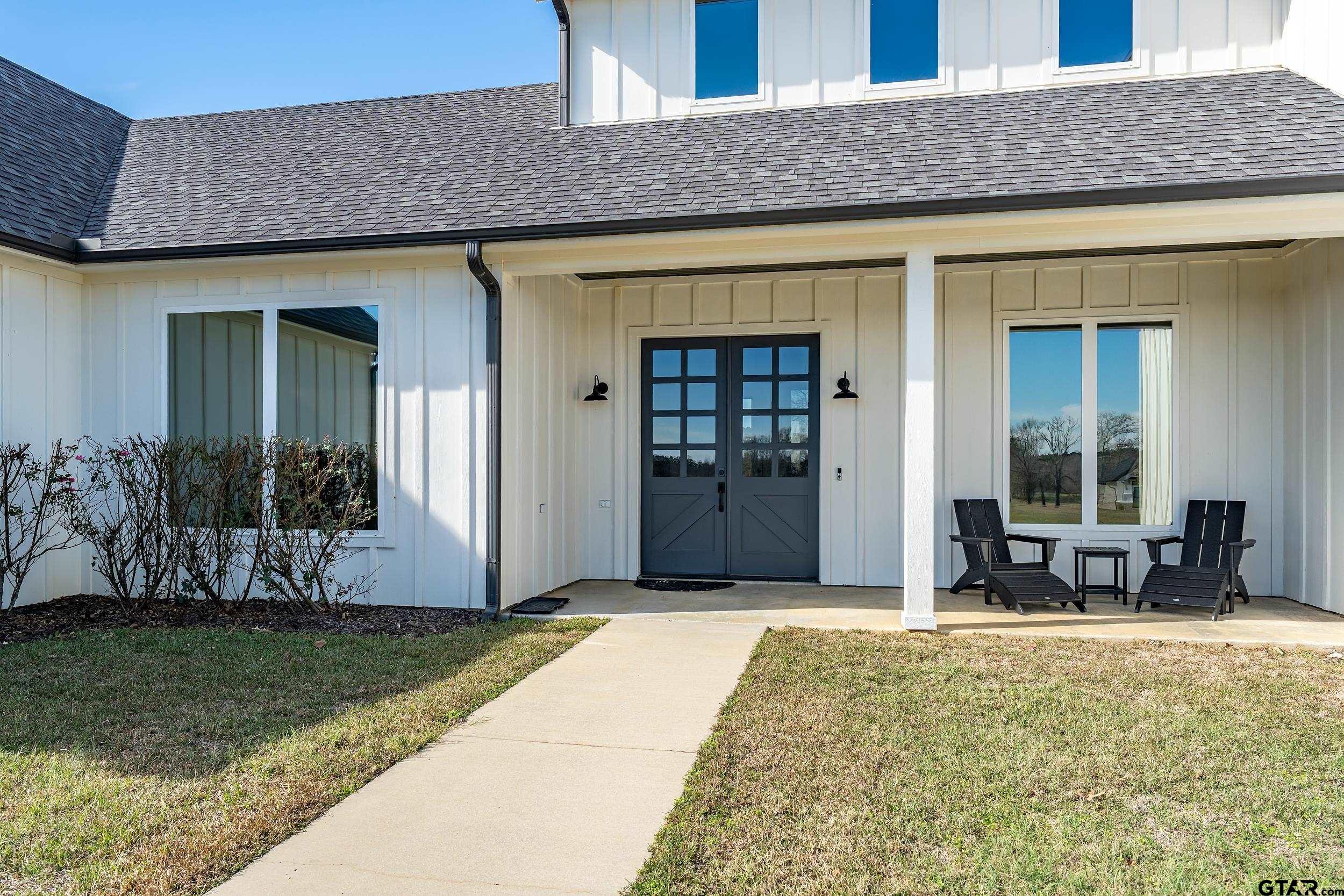 223 Riata Road Bullard, TX 75757 - Photo 4 of 45 a front view of a house with garden