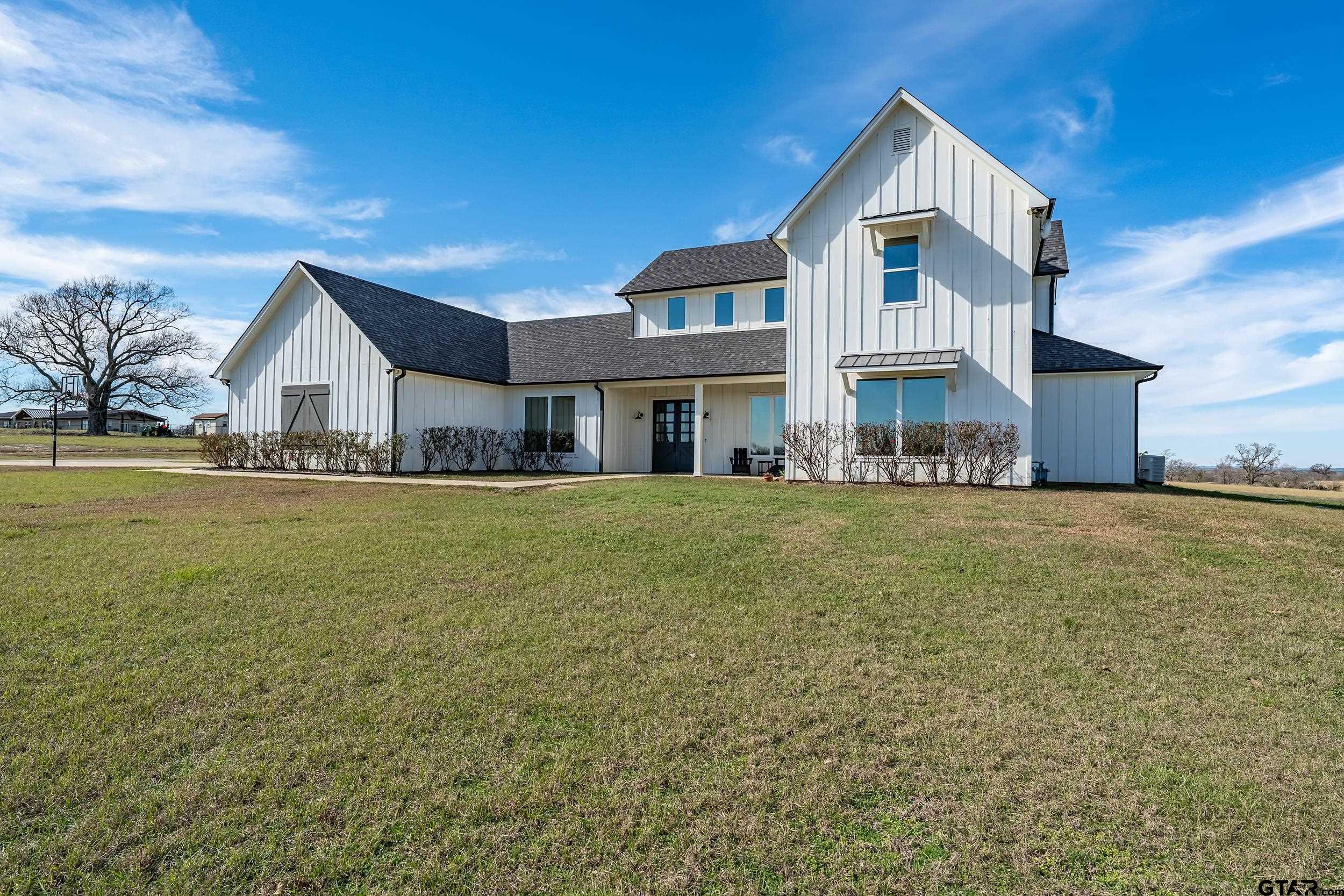 223 Riata Road Bullard, TX 75757 - Photo 45 of 45 a front view of house with yard and lake view